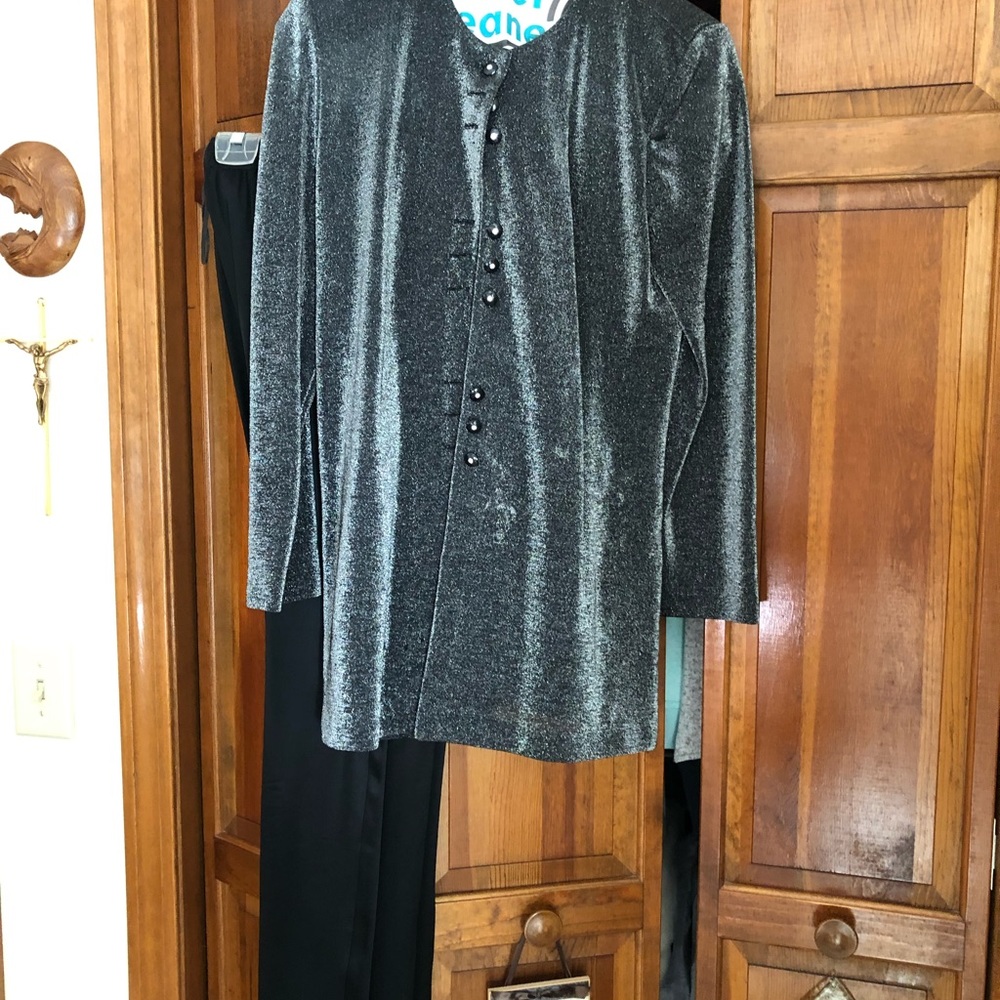 Black pants and black shimmering jacket
